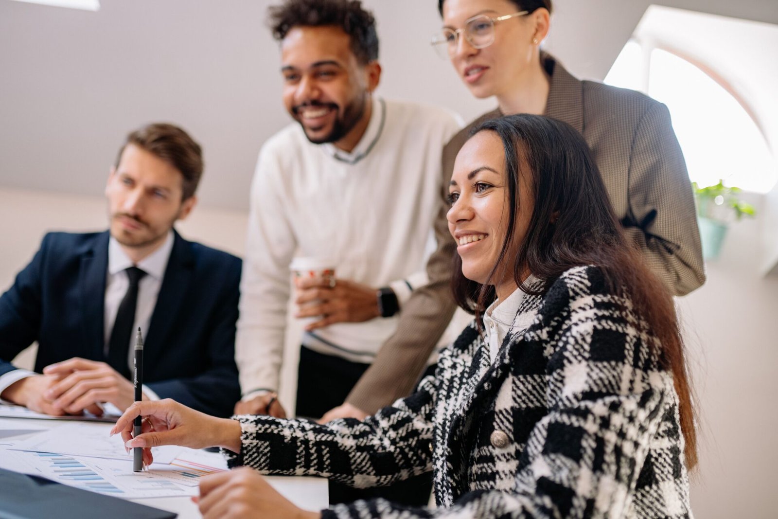 Businesspeople smiling together in a meeting