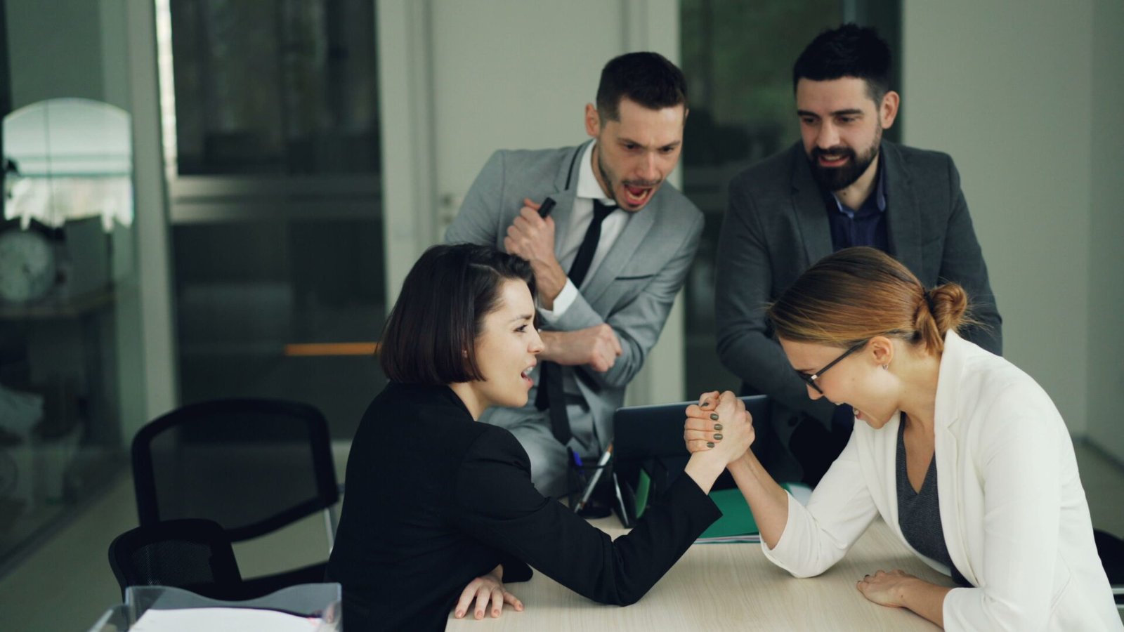 Colleagues in a team-building exercise, modern office